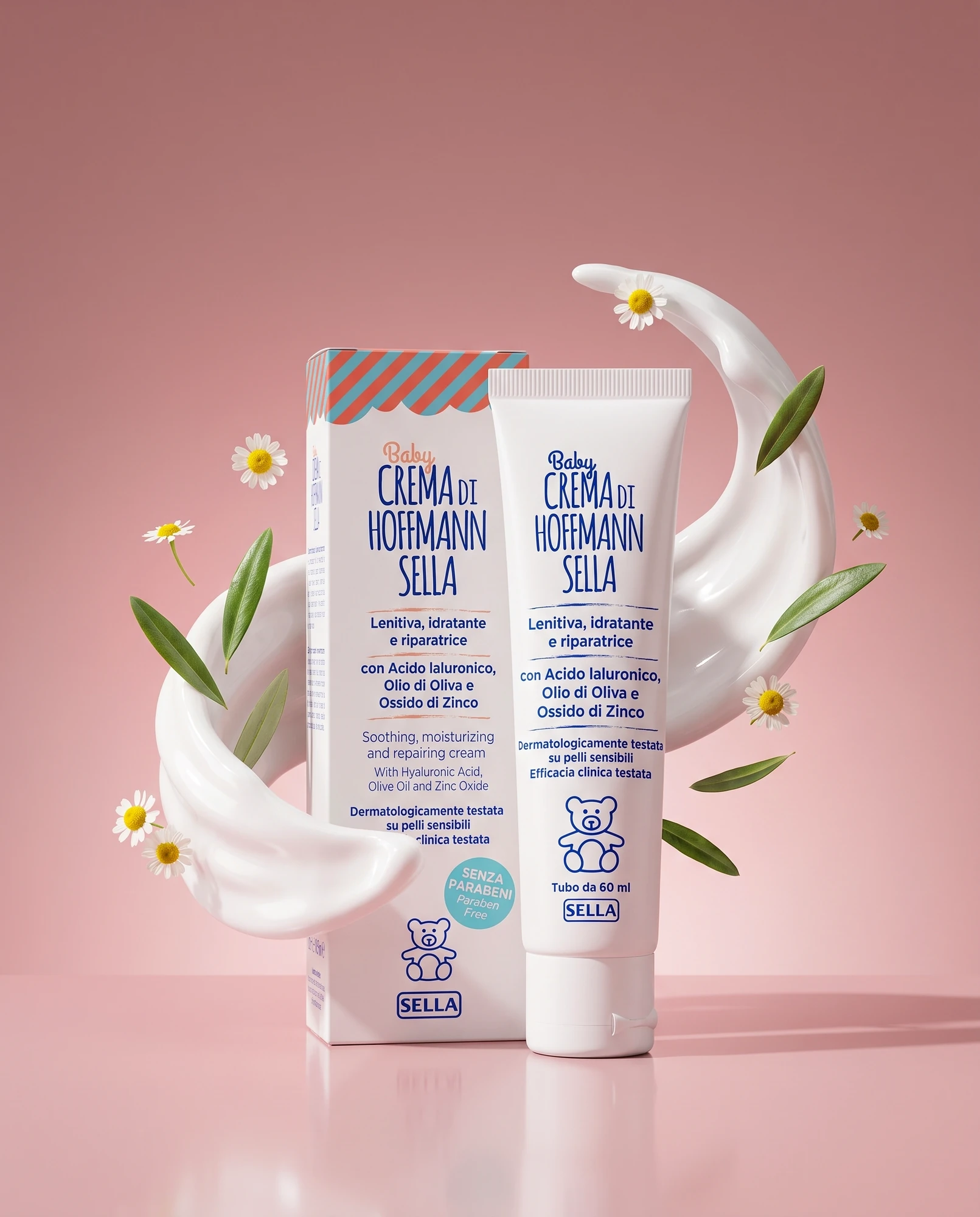 Tubo e confezione di Baby Crema di Hoffmann Sella con crema, margherite e foglie d'ulivo su sfondo rosa