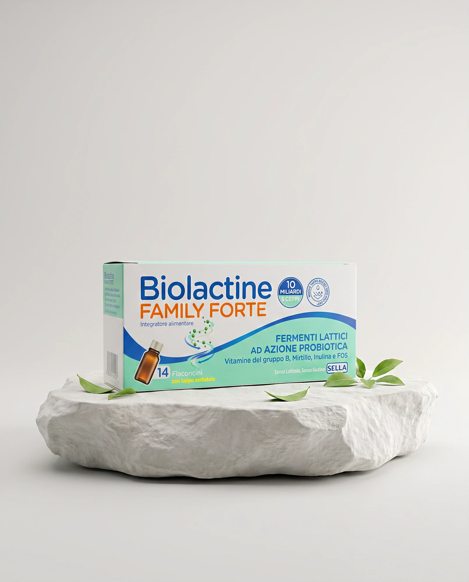 Confezione di Biolactine Family Forte, fermenti lattici, su roccia bianca con foglie verdi